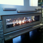 Linear fireplace mantel with floating shelves